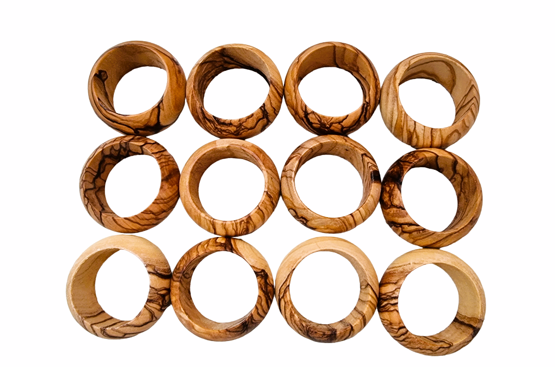 Twelve Olive Wood Napkin Rings Closely Together.