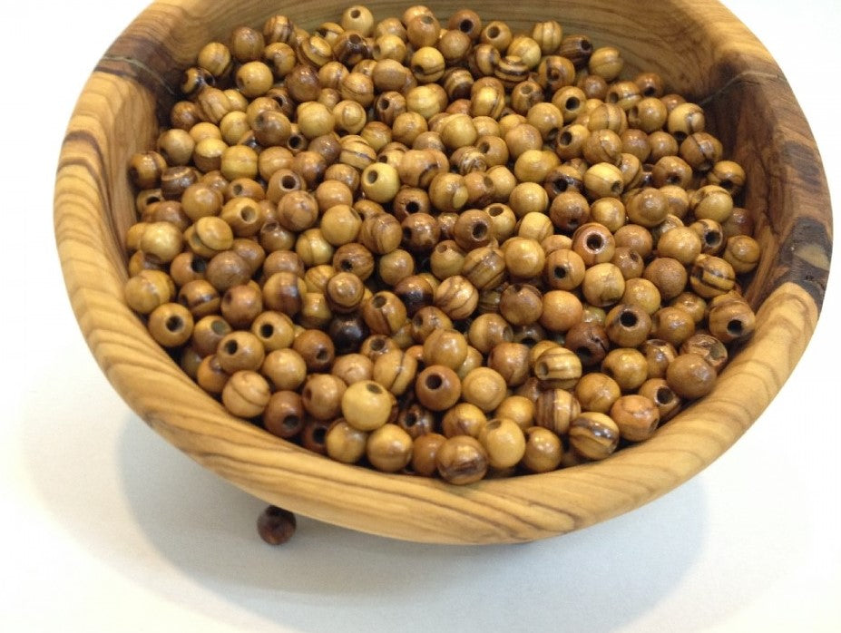 12mm Round Olive Wood Beads From Bethlehem In A Wooden Tub.